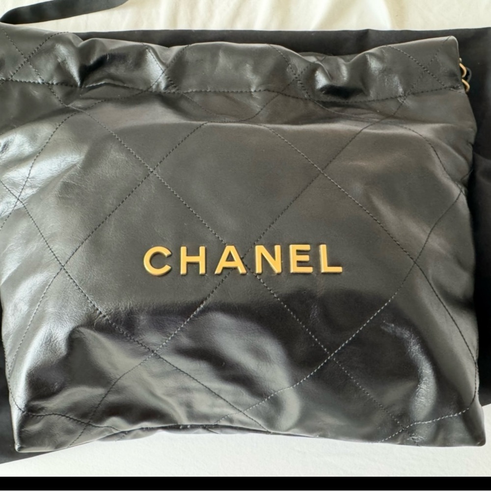 CHANEL 22 Small Black Quilted Leather Bag with Gold Logo